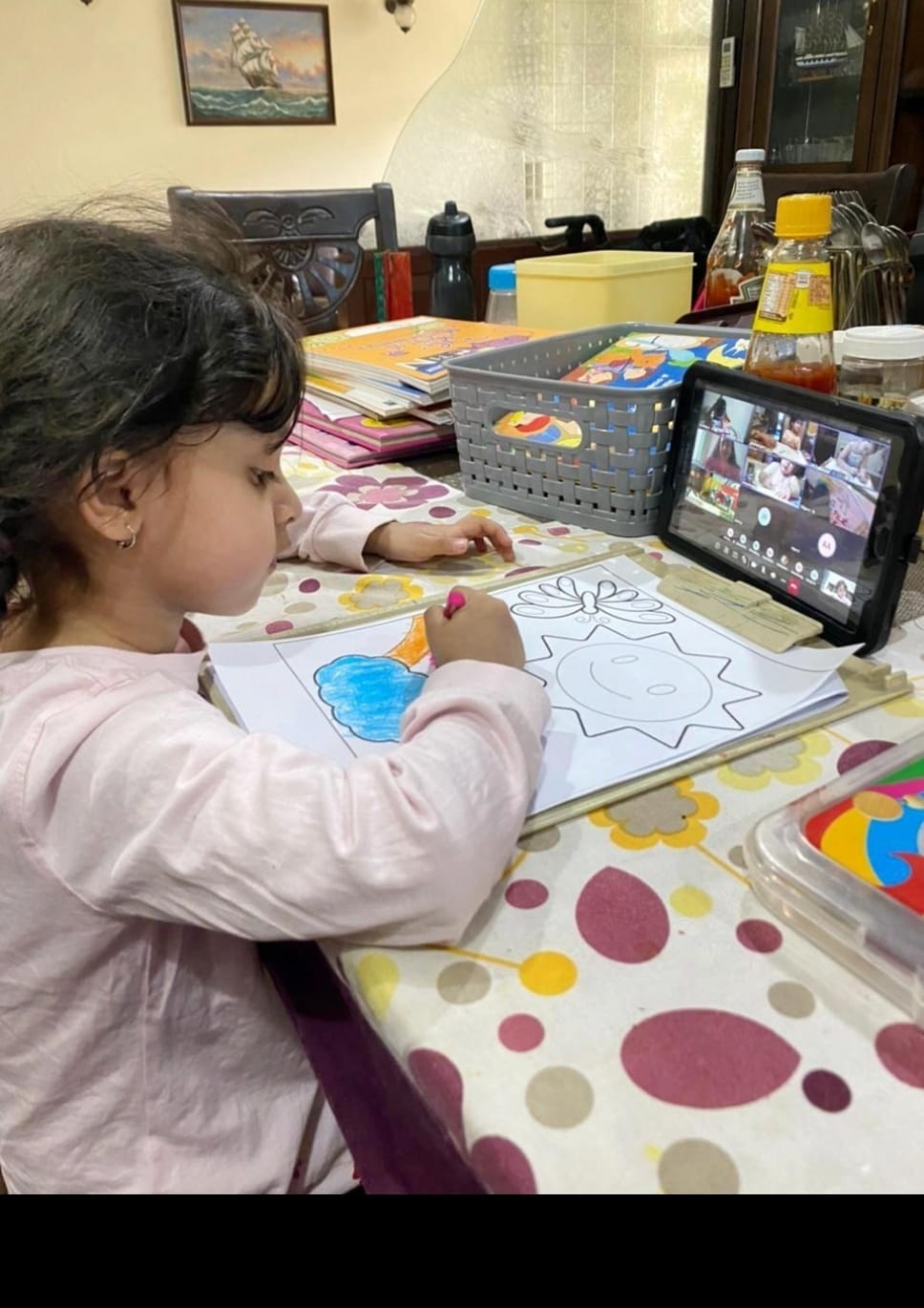Child drawing during a video call