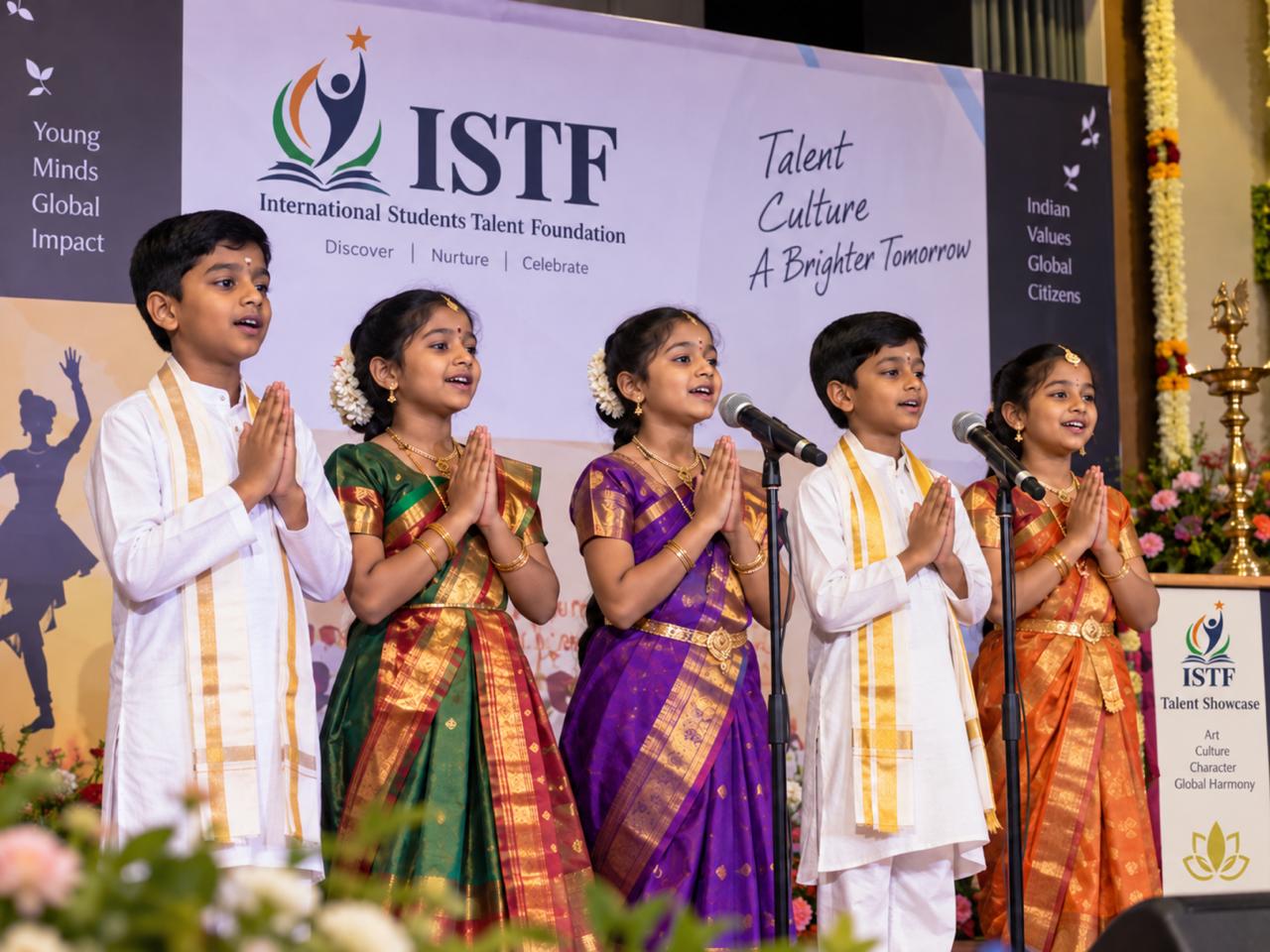 Young performers singing on stage at an ISTF showcase